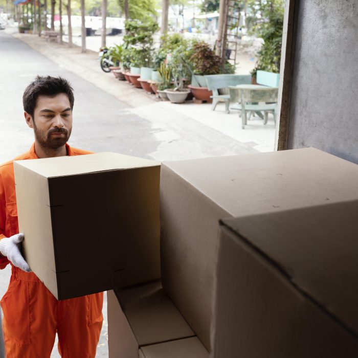 delivery-man-loading-car-with-delivery-boxes